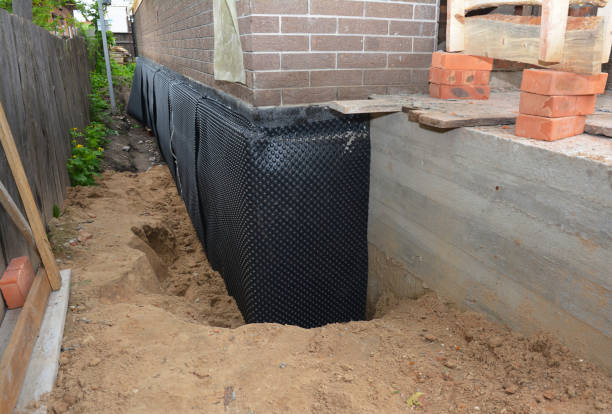 Happy homeowners after waterproofing job in College Corner